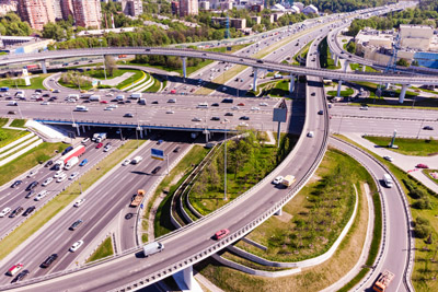 aerial-view-of-a-freeway-intersection-road-junctions-in-a-big-city_web